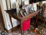 a table with pictures and pictures on it in a living room