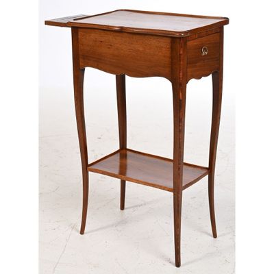 a wooden table with a drawer underneath it and a shelf underneath it