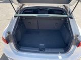 a trunk of a white car with its doors open