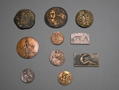 a lot of coins that are sitting on a table