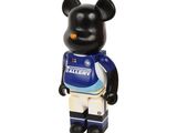 the bear is wearing a blue jersey and white shorts