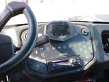 a close up of a steering wheel and dashboard of a vehicle