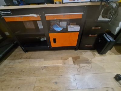 a picture of a computer desk with a printer on it