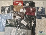a lot of men ' s shirts that are wrapped in plastic