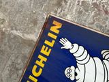 a blue sign with a picture of a cartoon character on it