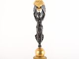 pair of antique bronze figurines of a woman holding a basket of flowers
