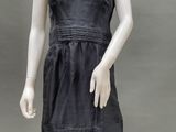 an image of a mannequin dressed in a black dress