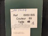 the label is attached to the back of a black jacket