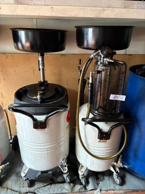 two buckets and a tank on a shelf next to a blue bucket