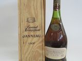 a bottle of wine sitting next to a wooden box