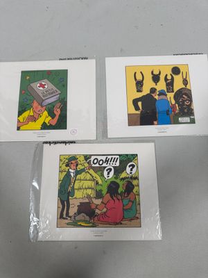 three comics are sitting on a table with a person holding a cell phone