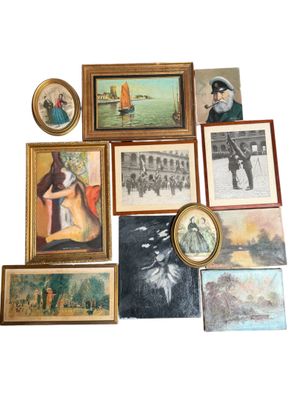 a lot of framed pictures on the wall of this room