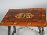a wooden table with a decorative design on it