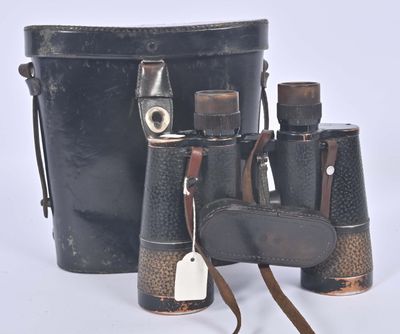 a black bucket with a pair of binoculars next to it