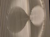 a picture of a wall made of paper with a circular design on it