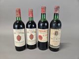 trois bouteilles de vin sont alignées sur une table