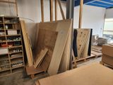 several pieces of wood are stacked on top of each other in a room