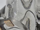 a close up of a glass vase with a piece of wood sticking out of it