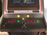 a small arcade machine that is sitting on a table