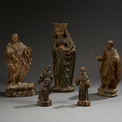 several figurines of different sizes and shapes are displayed on a gray surface