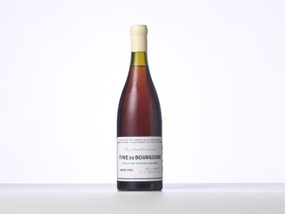a bottle of wine sitting on top of a table