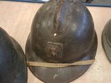 several helmets are lined up on a table in a warehouse