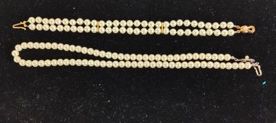 a close up of two pearls on a black surface