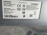 a close up of a samsung laptop with a sticker on it