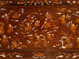 a large wooden table with a painting on it