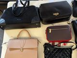 a lot of purses that are on a table