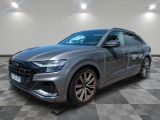 a grey audi qx parked on a checkered floor