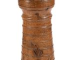 an old wooden bell with a wooden handle on a white background
