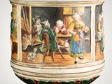 a large vase with a painting on it on a table
