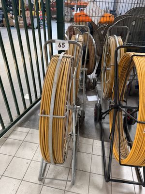 a lot of hoses that are sitting on a cart
