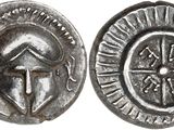a close up of a silver coin with an image of a woman on it