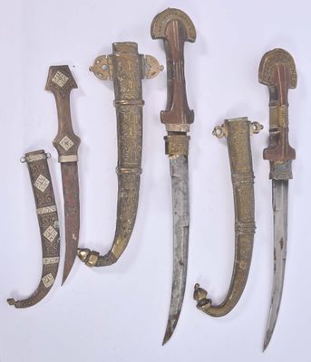 several different types of knives are displayed on a white surface