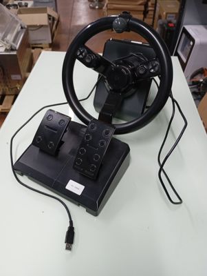 a steering wheel that is sitting on top of a table