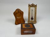 a small wooden box with a clock on it and a small wooden box with a clock on it