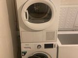 a washer and a dryer in a small room