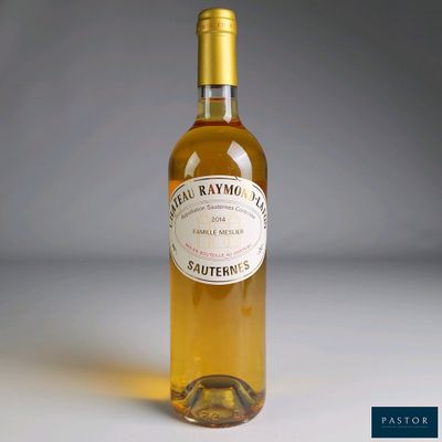 a bottle of wine that is sitting on a table