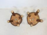 two wooden chairs that are sitting on the floor