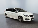 the white car is parked in a white room with a black floor