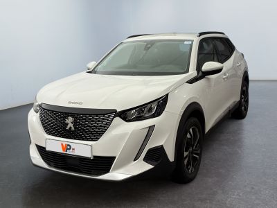 the white car is parked in a large room with a black floor