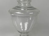 a clear glass jar with a lid on a table