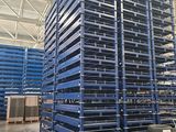 pallet racking in a warehouse with tires stacked on top of each other