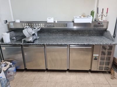 a kitchen with stainless steel appliances and granite counter tops