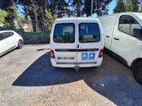 a white van parked next to a white van in a parking lot