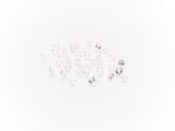 white and clear crystal beads scattered on a white surface