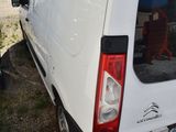 a white van that is parked in a lot
