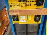 a machine that is sitting on a pallet in a warehouse